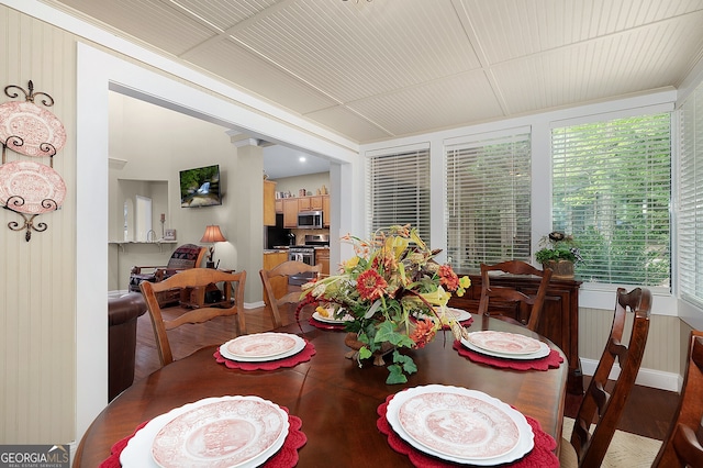 dining room with wood finished floors and baseboards