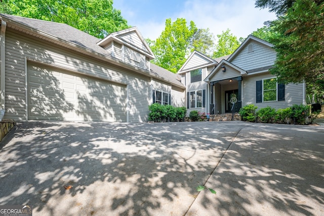 view of front of home with driveway and an attached garage