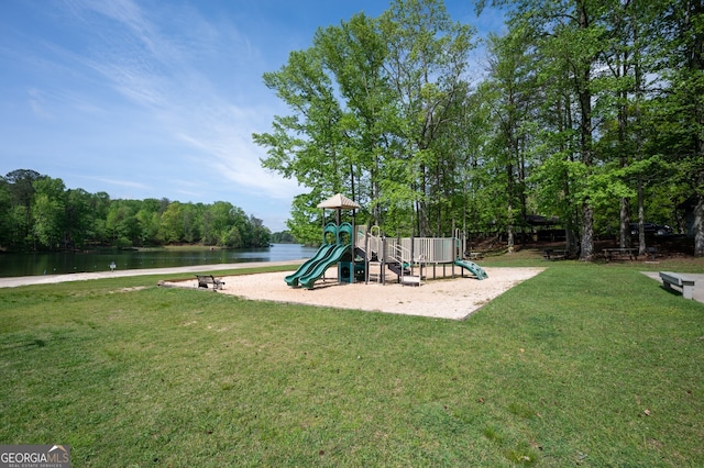 community play area featuring a yard and a water view
