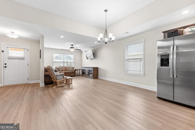 interior space with baseboards, recessed lighting, and light wood-style floors