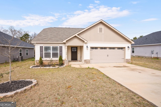 ranch-style home featuring a front lawn, cooling unit, an attached garage, driveway, and brick siding