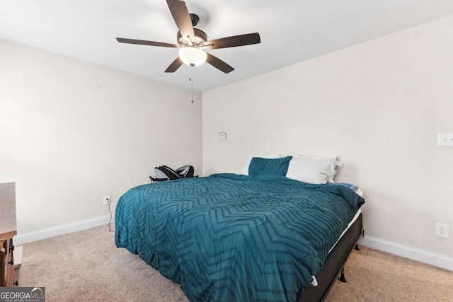 carpeted bedroom with baseboards and ceiling fan