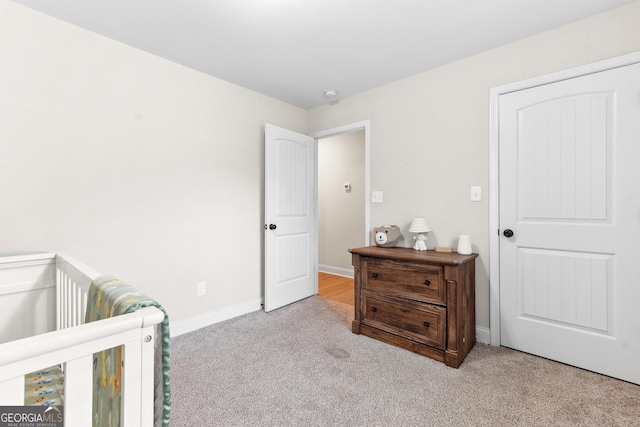 carpeted bedroom with baseboards