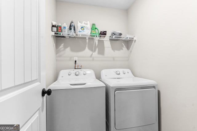 laundry room featuring washer and dryer and laundry area
