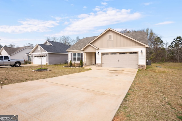 craftsman house with an attached garage, driveway, a shingled roof, and a front yard