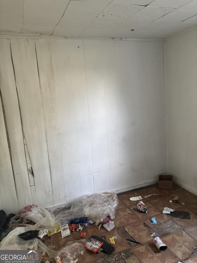 empty room featuring a paneled ceiling