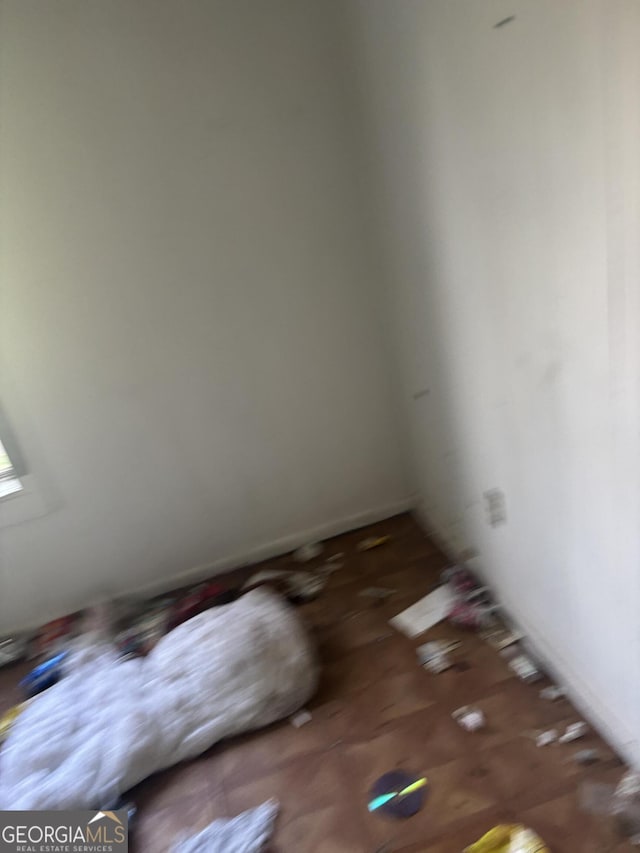 spare room featuring baseboards