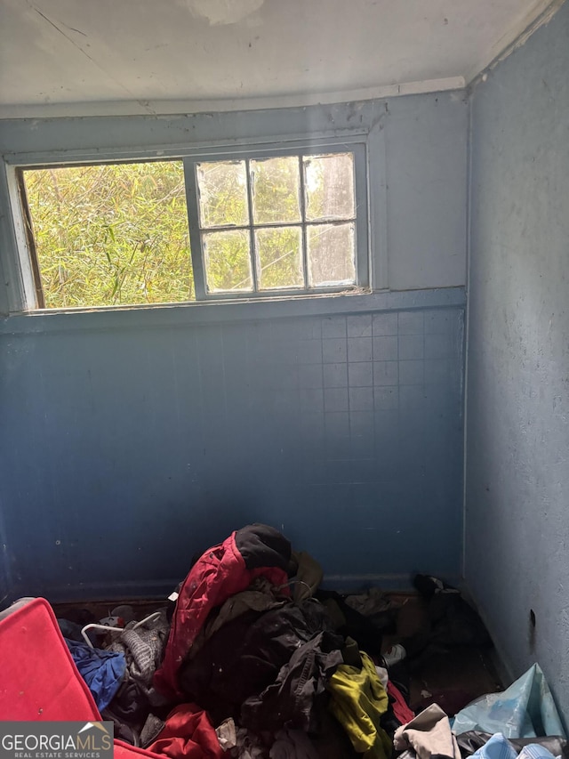 unfurnished bedroom with multiple windows