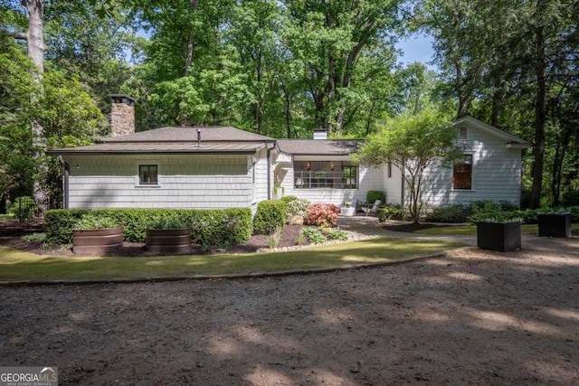 view of front of property featuring a chimney