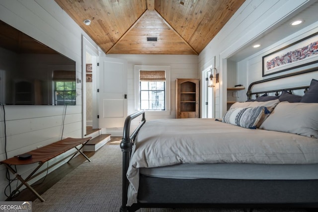 bedroom with recessed lighting, wood finished floors, wood ceiling, wooden walls, and lofted ceiling