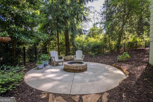 view of patio / terrace with a fire pit and a fenced backyard