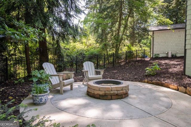 view of patio / terrace featuring a fenced backyard and an outdoor fire pit