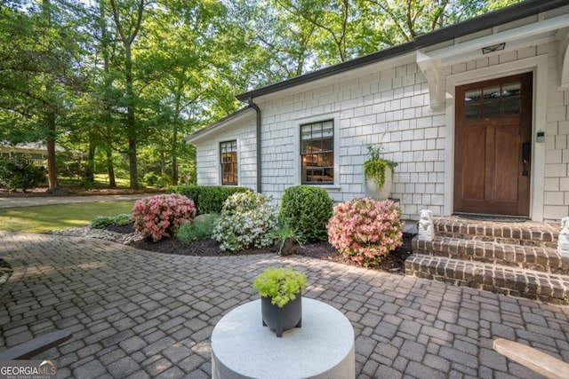 property entrance featuring a patio