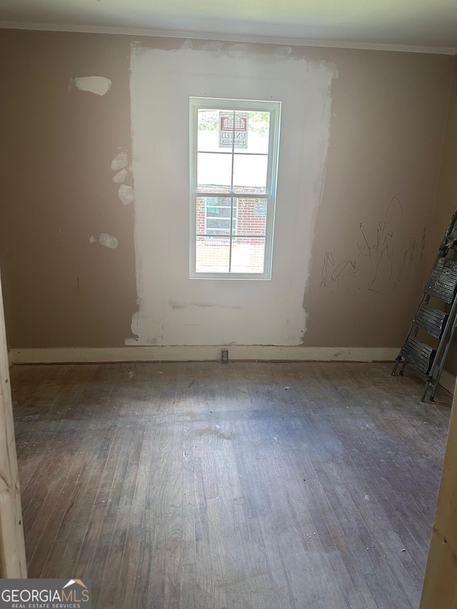 183 S Pine St, Toccoa, GA 30577 - empty room featuring baseboards, crown molding, and hardwood / wood-style flooring