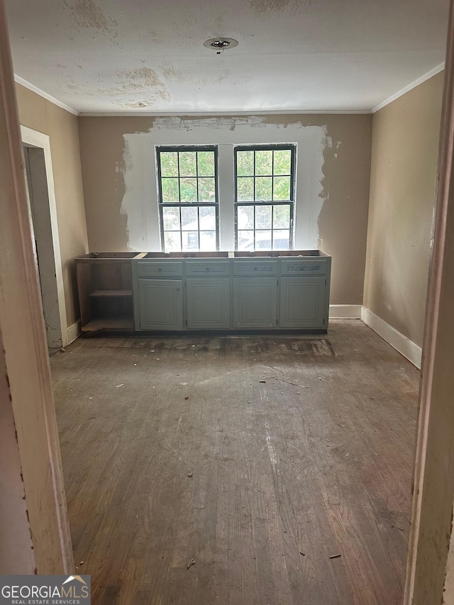 183 S Pine St, Toccoa, GA 30577 - spare room featuring wood finished floors, crown molding, and baseboards
