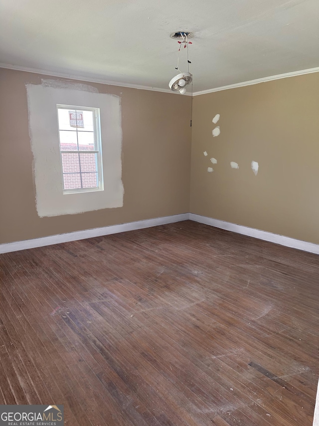 183 S Pine St, Toccoa, GA 30577 - spare room featuring baseboards and ornamental molding