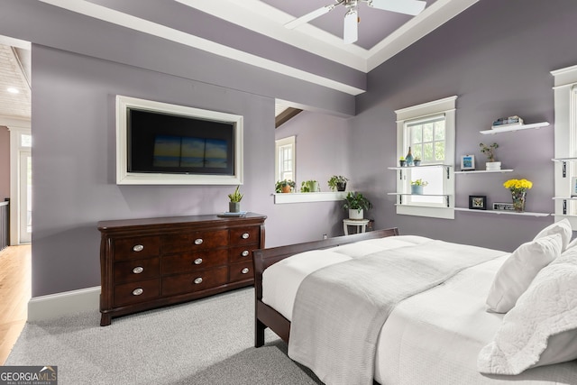 carpeted bedroom with a ceiling fan and baseboards