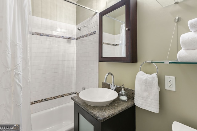 bathroom with shower / bath combo and vanity