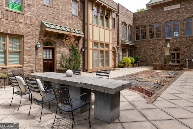 view of patio with outdoor dry bar