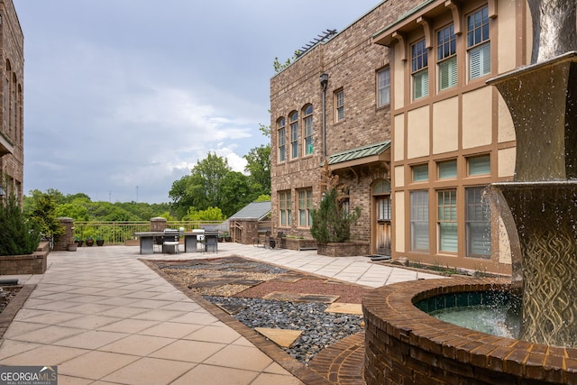 view of home's community featuring a patio