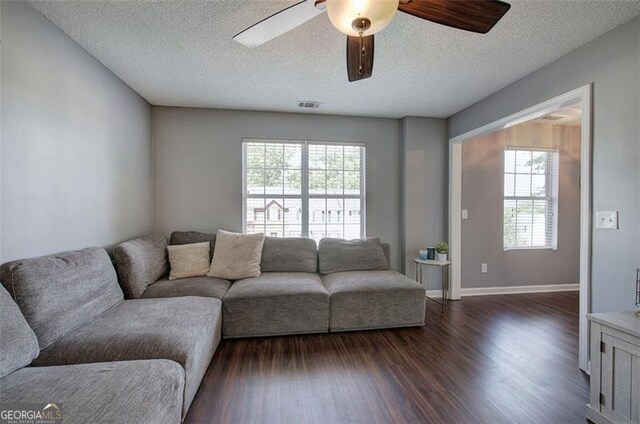 50 Westside Chase, Cartersville, GA 30120 - living area with dark wood-style floors, visible vents, a ceiling fan, baseboards, and a textured ceiling