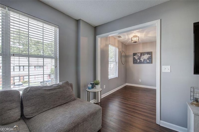 50 Westside Chase, Cartersville, GA 30120 - living area with dark wood finished floors, a textured ceiling, and baseboards