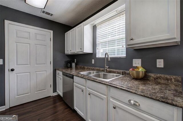 50 Westside Chase, Cartersville, GA 30120 - kitchen with a sink, dark countertops, visible vents, white cabinetry, and dishwasher