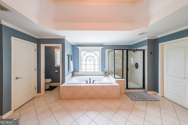 bathroom featuring a stall shower, a garden tub, visible vents, and toilet