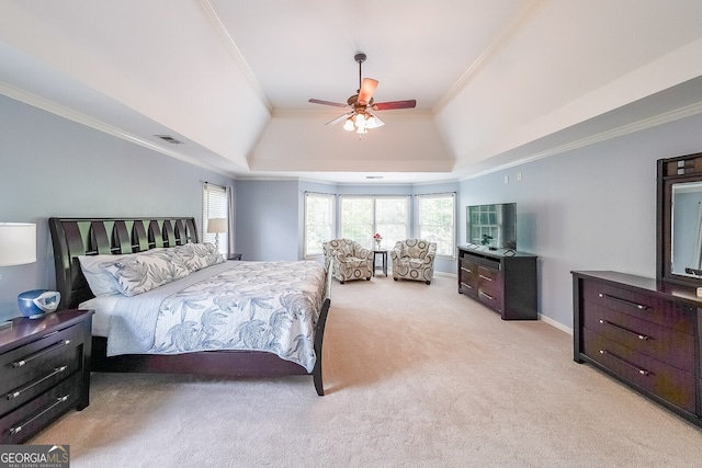 bedroom featuring a tray ceiling, visible vents, a ceiling fan, ornamental molding, and light colored carpet