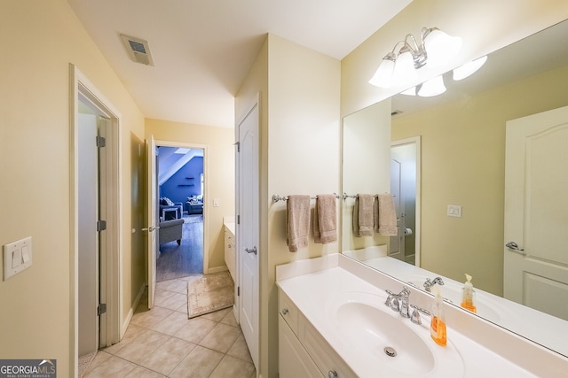 bathroom featuring visible vents, tile patterned floors, and vanity