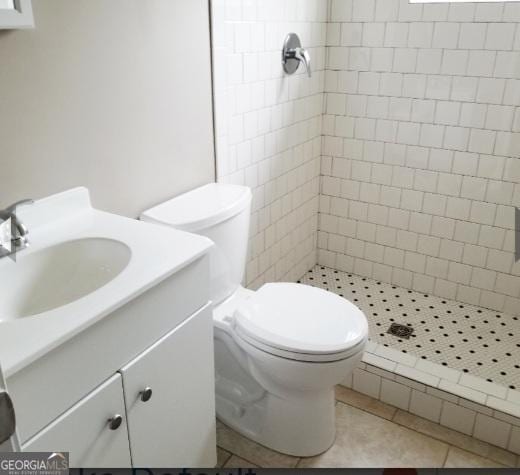1323 S Hairston Rd, Stone Mountain, GA 30088 - bathroom with a shower stall, toilet, vanity, and tile patterned flooring