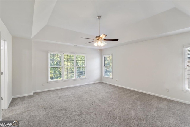 unfurnished room featuring carpet floors, baseboards, and a ceiling fan
