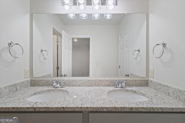 bathroom featuring double vanity
