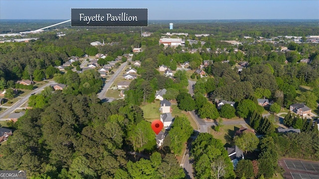 aerial view of property's location with a forest