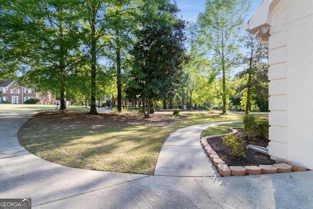 surrounding community featuring a lawn