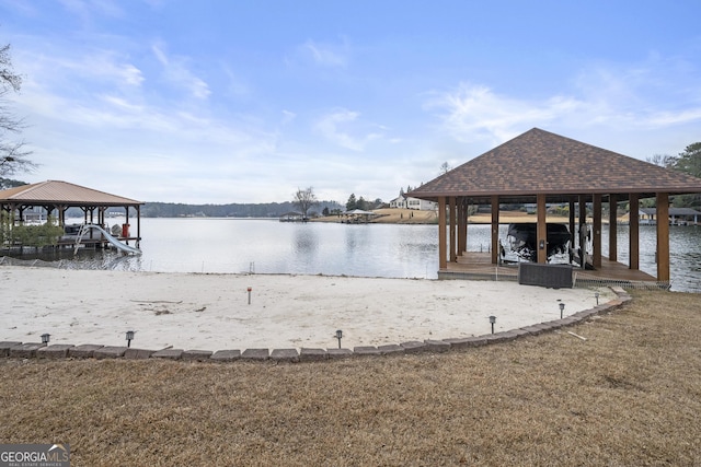 view of dock featuring a gazebo and a water view