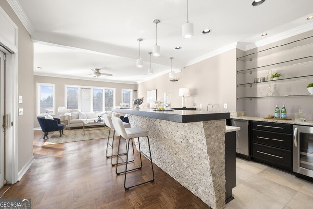 bar featuring recessed lighting, beverage cooler, wet bar, ornamental molding, and pendant lighting