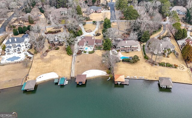birds eye view of property with a residential view and a water view
