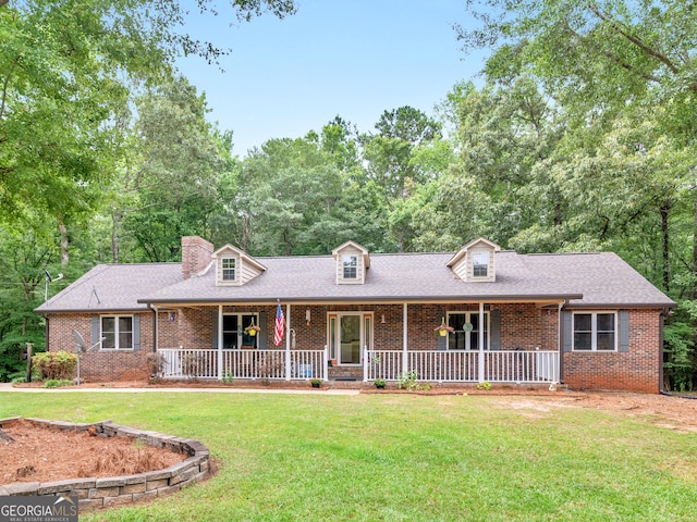 930 Singley Dr, Locust Grove, GA 30248 - view of front of property with brick siding, a front lawn, and covered porch