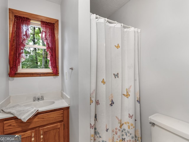 930 Singley Dr, Locust Grove, GA 30248 - bathroom featuring curtained shower, toilet, and vanity