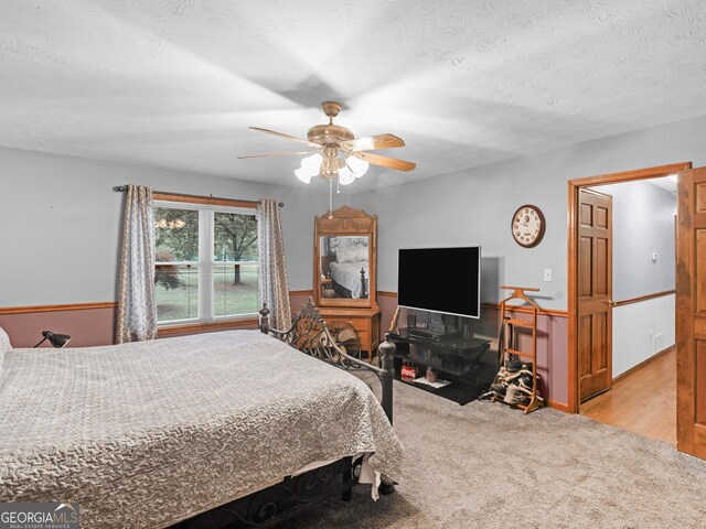 930 Singley Dr, Locust Grove, GA 30248 - bedroom with a ceiling fan, carpet flooring, and a textured ceiling