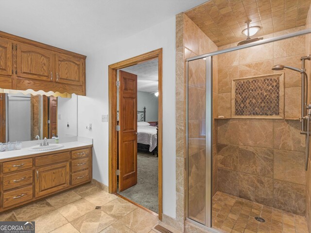930 Singley Dr, Locust Grove, GA 30248 - bathroom with baseboards, ensuite bath, vanity, and a shower stall