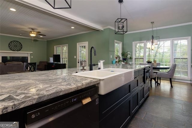 225 Nacoochee Dr, Woodstock, GA 30188 - kitchen featuring light stone counters, a sink, a glass covered fireplace, black dishwasher, and recessed lighting