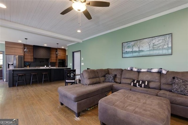 225 Nacoochee Dr, Woodstock, GA 30188 - living room with beamed ceiling, light wood finished floors, recessed lighting, and ceiling fan
