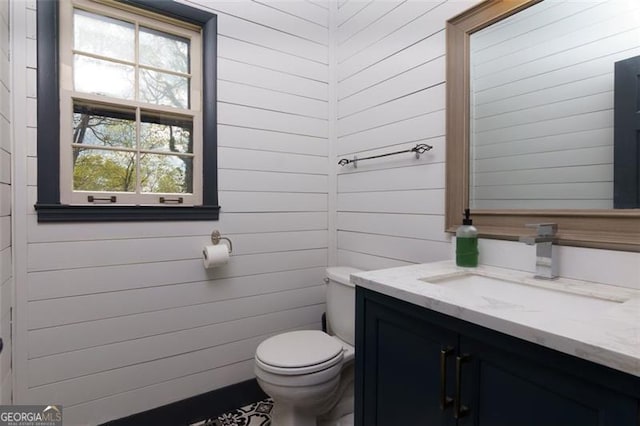 225 Nacoochee Dr, Woodstock, GA 30188 - half bath featuring toilet, wood walls, and vanity