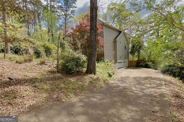 225 Nacoochee Dr, Woodstock, GA 30188 - view of home's exterior featuring a garage and concrete driveway