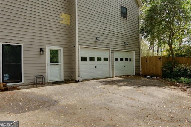 225 Nacoochee Dr, Woodstock, GA 30188 - garage with fence and aphalt driveway