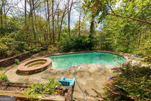 225 Nacoochee Dr, Woodstock, GA 30188 - view of pool featuring a pool with connected hot tub and a patio