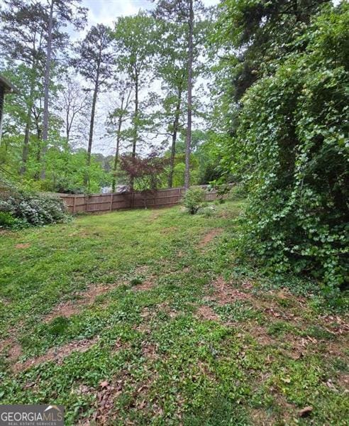 225 Nacoochee Dr, Woodstock, GA 30188 - view of yard featuring fence