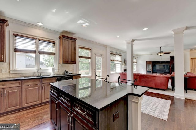 2725 Monet Dr, Cumming, GA 30041 - kitchen featuring a sink, ornamental molding, ornate columns, and ceiling fan